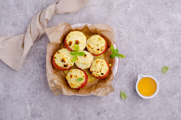Stewed tomatoes stuffed with cheese