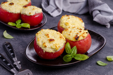 Stewed tomatoes stuffed with cheese