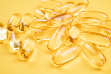 Omega 3 capsules.Vitamin drop pill capsule. Shining golden essence droplet.	
