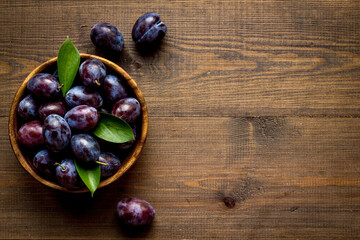 Layout set of ripe purple plums. Top view