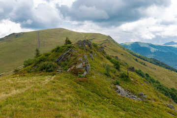 Verkhovyna Watershed Range, Pikui Mountain. Carpathian mountains with grassy slopes and rocks on Pikuy mount. Beautiful mountain landscape in summer