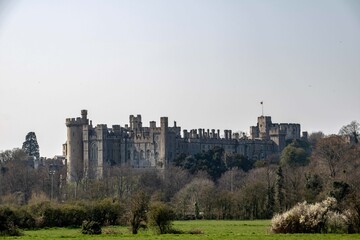Fototapeta na wymiar Arundel Castle is a restored and remodelled medieval castle in Arundel, West Sussex, England. It was established by Roger de Montgomery on Christmas Day 1067