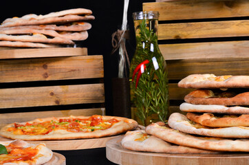 Fresh pizza with tomatoes, cheese and mushrooms on wooden table closeup