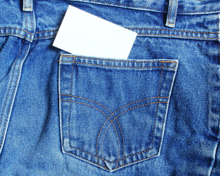 blank business card in pocket of blue jeans pant