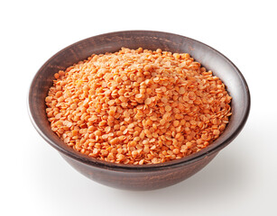 Red lentils in ceramic bowl isolated on white background with cliping path