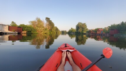 Walk along the river by kayak. evening river