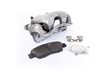 Obraz premium Standard brake caliper of car brake pad and lock part in white background