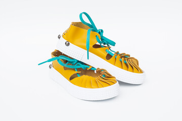 A pair of handmade suede leather sandals in ancient greek and roman style. Selective Focus.