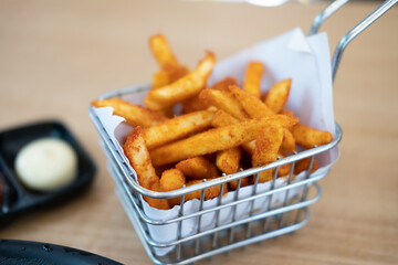 French fries with cheese powder served in basket