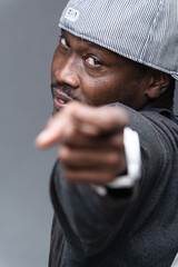 Young man offers a variety of poses and attitudes during a studio photo session