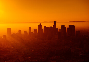 Warm orange sunset behind the skyline of Los Angeles. Original public domain image from Wikimedia Commons