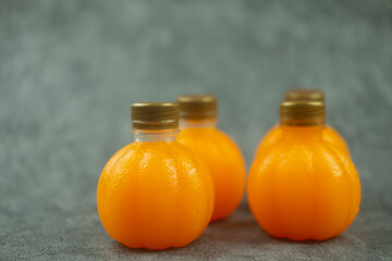 Plastic mini bottle of organic fresh orange juice