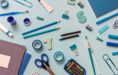 School supplies flat lay, stationery on blue background. Education, Back to School, kids creativity concept