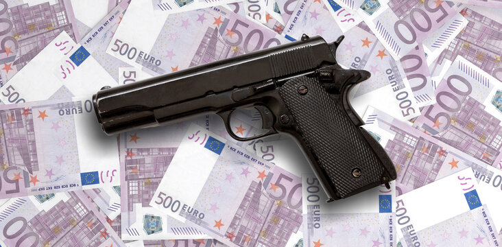 Criminal money. Pistol on euro banknotes background, top view. Mafia and corruption concept