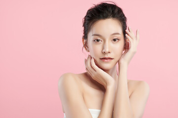 Beautiful young asian woman with clean fresh skin on pink background, Face care, Facial treatment,...