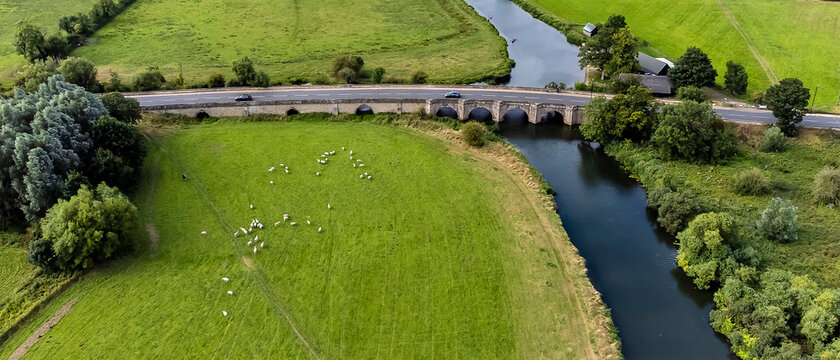 An aerial panorama view above the bridge across the River Nene near at Oundle, UK on a summers day