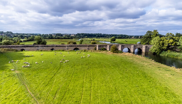 An aerial panorama view towards the bridge across the River Nene near at Oundle, UK on a summers day