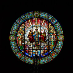 Montserrat, Spain - April 5, 2019: Stained-glass window in Benedictine Abbey of Santa Maria de...