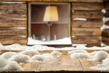 Wooden desk with snow and winter window 