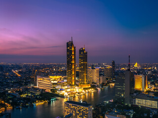 Night cityscape of famous downtown with Chao Phraya river in Bangkok Thailand