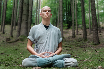 Warrior monk meditating in woodland