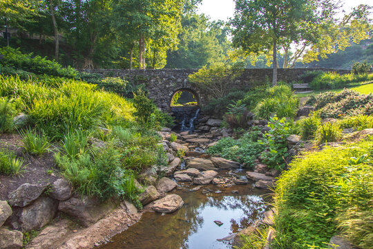 Stone bridge with a stream in the middle of a park