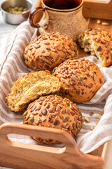 Gluten-free bread from corn flour and seeds close-up. Homemade bread with pumpkin and sunflower seeds. Breakfast buns.