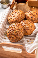 Gluten-free bread from corn flour and seeds close-up. Homemade bread with pumpkin and sunflower seeds. Breakfast buns.