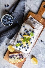 Lemon blueberry loaf of bread cake with sugar glaze