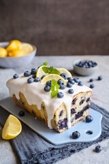 Lemon blueberry loaf of bread cake with sugar glaze