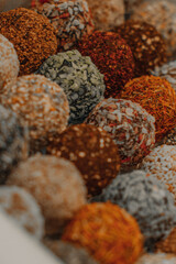 Assorted handmade truffle chocolates candies made from organic ingredients. Raw food diet concept.