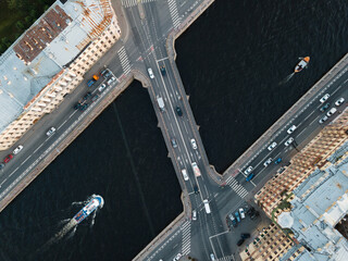 View from above on Ismaylovsky bridge across Fontanka river. Blurred car motion on bridge. A...
