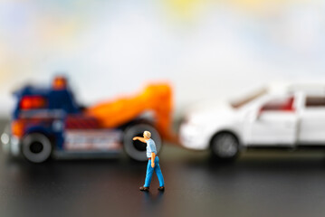 Miniature people aggrieved party dispute car accident in public road street using for Car Automotive maintenance repair fixed or replacement Service or Vehicle Insurance guarantee or drive safety