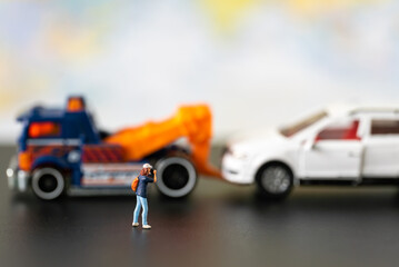 Miniature people Insurance Broker officer take photo car accident in public road using for Car Automotive maintenance repair fixed or replacement Service or Vehicle Insurance guarantee or drive safety