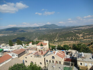 View of iconic red rooftops of Safed and Galilee mountains in Israel