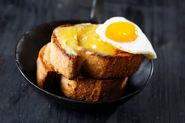 rustic french cheese toast with egg croque madame