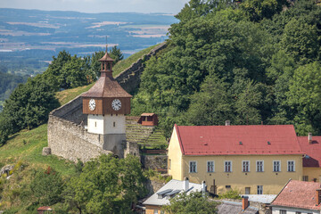Fototapeta na wymiar historic clock tower above the castle fortifications
