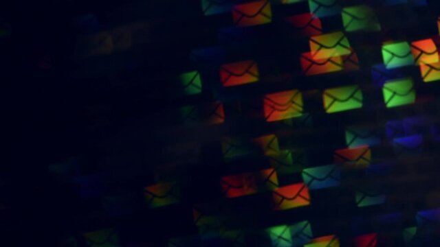 Multiple email envelopes floating against dark background. Envelop-shaped blur bokeh moving in in an arc and shimmer with the colors of the rainbow. LGBT connection concept. 