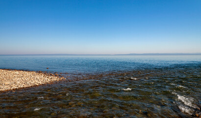 Coastline of Lake Baikal at the confluence of the Osinovka River on the south-eastern coast.