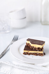 A plate with a Nanaimo bar - a traditional Canadian dessert