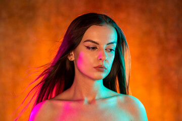 Portrait shot of a pretty young woman in RGB colors.