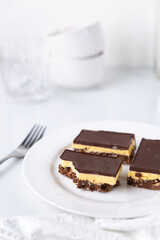A plate with Nanaimo bars - a traditional Canadian dessert