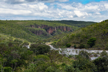 Fototapeta na wymiar A river crossing a forest in the Brazilian savannah. Midwest of Brazil. Rock formations. Nature. Cerrado.