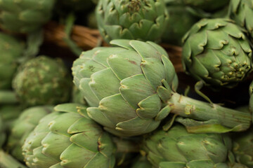 Fototapeta premium Fresh artichokes on market counter