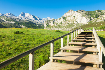 view with a wooden walkway to national park peaks of europe