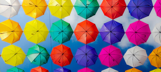 Fototapeta na wymiar colored umbrellas line up