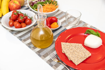 Nutritious dishes prepared with mozzarella salad and tomatoes. Natural and healthy ingredients of the Mediterranean diet: olive oil, cereals, peppers, vegetables, fruit and cheese. Farmers products