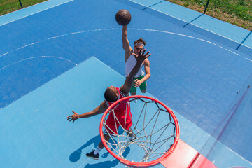 Overhead view of multiethnic sportsmen playing streetball