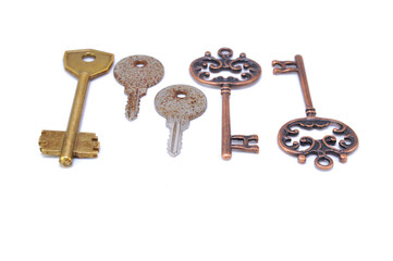 Vintage key on white background close-up. Texture, background, old, macro, wallpaper, metal, brass
