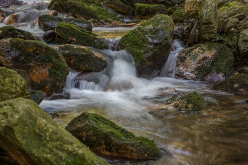 cascade and boulders in a mountain stream